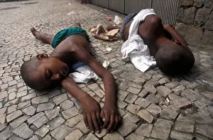 Destitute Prints: Homeless young boys sleeping in the street Copacobana Rio de Janeiro Brazil