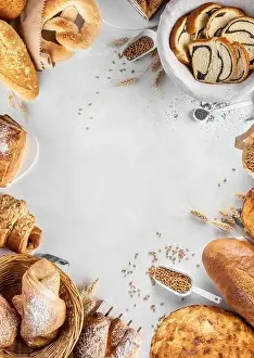 Croissant Prints: Homemade freshly bakery products on a fray background from the top view with bread rolls croissant pretzel with