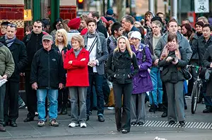 Hurry Prints: Homeward-bound commuters at the pedestrian crossing outside Flinders Street station in Melbourne