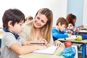 Tutor Prints: Homework student mentoring with a teacher in a full-time school