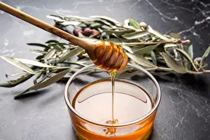 Sticky Prints: honey plate with olive wood spoon on table
