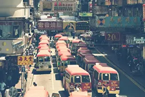 Hong Kong, China - August 14, 2017: Minibuses lining up, waiting for passengers at a busy station in Mongkok, Hong Kong, China