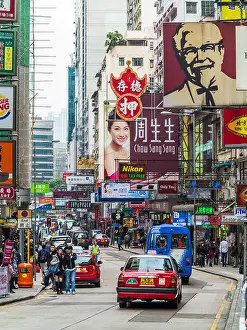 Crowded Prints: Hong Kong street scene - A busy street in the Tsim Sha Tsui district, Kowloon, Hong Kong
