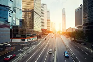 Road Speed Prints: Hong Kong street with traffic and skyscraper office in morning in Hong Kong. Asia