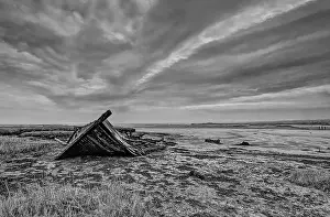 Hoo Peninsula marshes Medway estuary Kent with the remains of a derelict ship