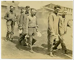 Dirt Road Prints: Horizontal, sepia photograph showing a group of seven men