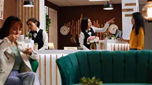 Lobby Prints: Hotel guest asking staff about amenities at holiday retreat