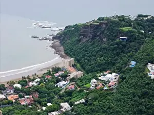 Hotel and houses under cliff in san juan del sur aerial drone view