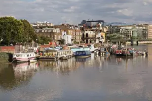 London Skyline Prints: Houseboats moored on the River Thames by Furnival Gardens, Hammersmith, London, UK
