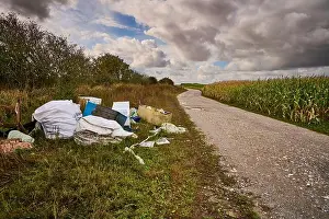Dump Prints: Household goods fly tipped on side of rural pathway