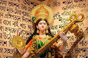Indian Festival Prints: Howrah, West Bengal, India - 17th February 2021 : Idol of Goddess Saraswati being worshipped inside pandal