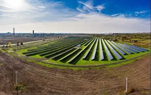 Photovoltaic Prints: Huge solar power plant to use solar energy in a picturesque green field in Ukraine