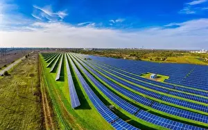 Photovoltaic Prints: Huge solar power plant to use solar energy in a picturesque green field in Ukraine