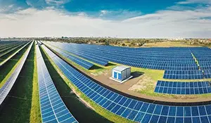 Green Power Prints: Huge solar power plant to use solar energy in a picturesque green field in Ukraine