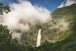 Minas Gerais Prints: A huge waterfall through the clouds in a blue sky day in Serra da Canastra