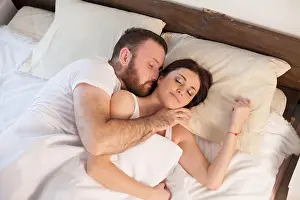 Wake Prints: husband and wife wake up in the morning in the bedroom of the weekend love