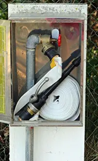 Firefighter Prints: hydrant with hose to put out fires inside the metal box