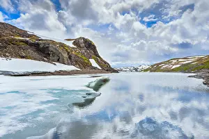 Mountainscape Prints: ice on a mountain lake and snowed mountains, Norway, Vikafjellsvegen, Riksvei, Rv 13