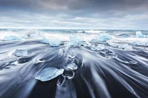 Images Dated 14th June 2016: Iceberg pieces on Diamond beach near Jokulsarlon lagoon, Iceland. Landscape photography