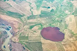 Iceland plane high angle view of Thorsa river and red water from airplane window above with Hrutsvatn or Ram's Lake