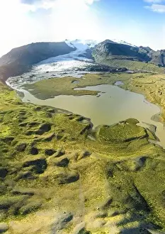 Weather Forecast Prints: Icelandic aerial landscape. Panorama of the Fjallsarlon glacier and the lagoon at sunset
