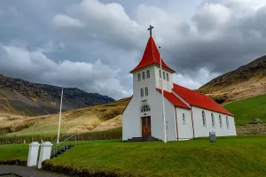 Knoll Prints: Icelandic church with a red roof perched on a hillside in southeastern Iceland