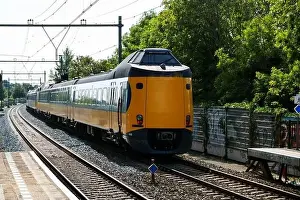 Public Transportation Prints: ICM Koploper intercity train of NS running along Nieuwerkerk aan den IJssel in the Netherlands