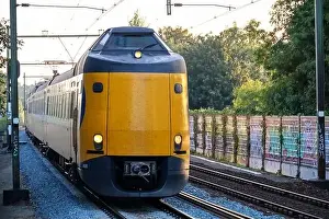 Public Transportation Prints: ICM Koploper intercity train of NS running along Nieuwerkerk aan den IJssel in the Netherlands