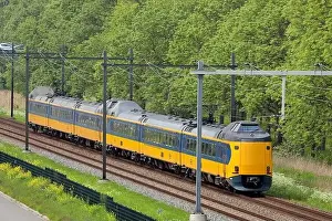 Public Transportation Prints: ICM Koploper intercity train of NS on track between Gouda and The Hague in the Netherlands