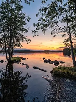 Idyllic landscape with beautiful sunset and tranquil mood at summer evening in Loppi, Finland