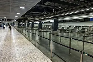 Check In Prints: Illuminated and Empty Airport Check in Counter in Zurich Airport at Night in Kloten