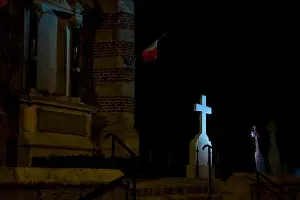 Midnight Prints: Illuminated cross in cemetery at night, Normandy, France