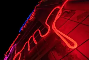 Cyberpunk Prints: Illuminated letters and words made with neon lights and LEDs of many colors and red and totally black background