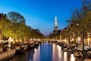 Image of Amsterdam, Netherlands - Amsterdam Westerkerk church tower at canal in the city of Amsterdam, Netherlands. Amsterdam