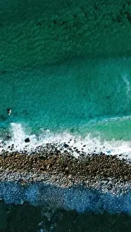 Drone Photo Prints: Image captured by a drone that shows the surprising contrast between the turquoise waters of the ocean
