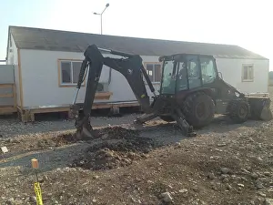 Contractors Prints: This image captures Equipment Operator Constructionman Tyler Burnham operating a 420D backhoe in Romania