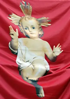 Image of the Christ-child on a banner outside the Igreja Sao Domingos, Lisbon, Portugal