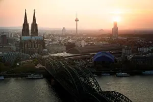 Image of Cologne with Cologne Cathedral with Rhine river and Hohenzollern bridge during sunset time in Germany