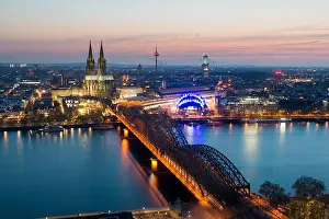 Image of Cologne with Cologne Cathedral with Rhine river and Hohenzollern bridge during twilight blue hour in Germany