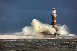 Rough Sea Prints: Image of a Lighthouse during a storm at Sunderland, Tyne and Wear, England, UK