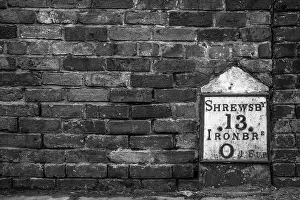 Cast Iron Prints: Image of an old cast iron mileage marker in Ironbridge