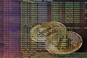 Image of the program code showing the process of mining the crypto currency in the background of the image with bitcoin