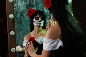 Witch Prints: Image of witch girl with white face and red flower on her head reflected in mirror on gloomy background