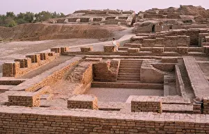 Indus Prints: Imran Khan, cricketer, sits in the ruins of the great bath at the ancient city of Mohenjodaro