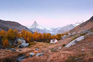 Incredible colorful sunrise on Grindjisee lake with Matterhorn Cervino peak in Swiss Alps. Zermatt resort location, Switzerland. Landscape photography