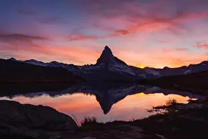 Splendid Prints: Incredible colorful sunset on Stellisee lake with Matterhorn Cervino peak in Swiss Alps