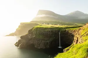 Incredible day view of Mulafossur waterfall in Gasadalur village, Vagar Island of the Faroe Islands, Denmark. Landscape photography