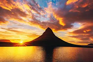 Incredible landscape with Kirkjufell mountain and colorful sunset sky on Snaefellsnes peninsula near, Iceland