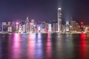 Commercial Hong Prints: The incredible night cityscape view of lights on the water on Victoria Harbour in Hong Kong