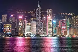 Commercial Hong Prints: The incredible night cityscape view of lights on the water on Victoria Harbour in Hong Kong